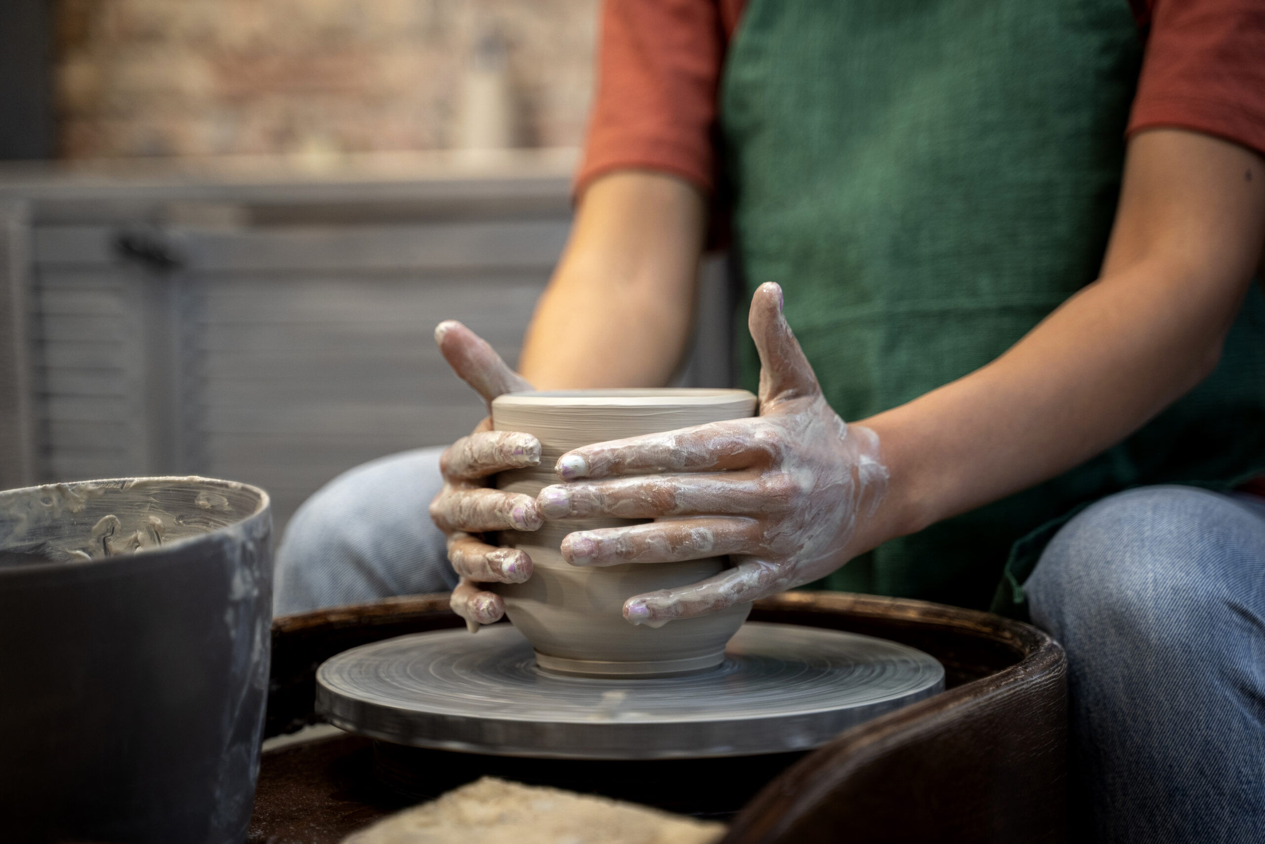 hands-doing-pottery-side-view