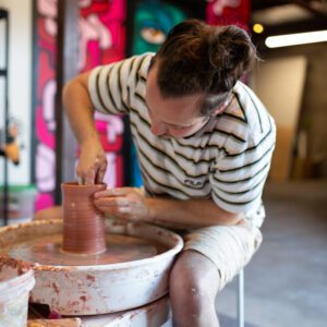 a person working on a pottery wheel