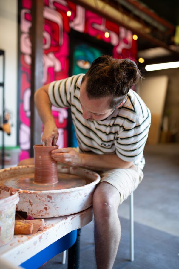 a person working on a pottery wheel